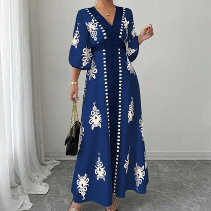 Elegantna ženska obleka v maxi kroju z V-izrezom in potiskom